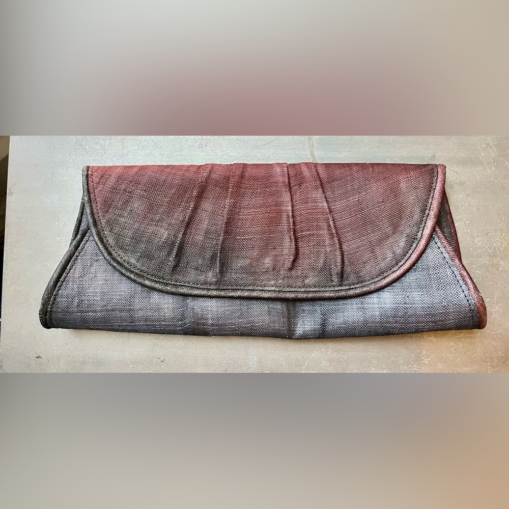 Banana Republic Elongated multi colored, stiff clutch.